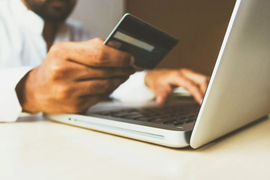 e-commerce website development in Egypt - hand holding credit card for online payment